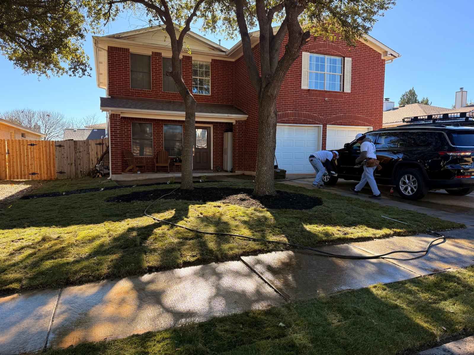 Front yard refresh: new sod, mulch beds and power-washed walks